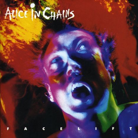 Text „ALICE IN CHAINS“ oben, „FACELIFT“ unten. Buntes Gesicht, schreit oder singt, mit intensivem Lichteffekt.