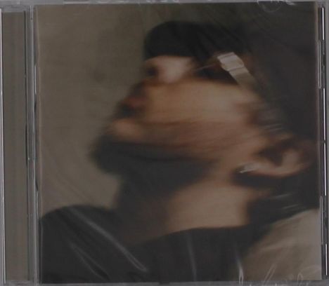 Verschwommenes Porträt eines Menschen im Profil, nach oben blickend. Dezent in gedeckten Farben gehalten.