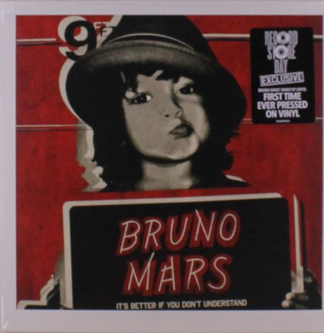 "Record Store Day Exclusive", "First time ever pressed on vinyl", "Bruno Mars", "It's better if you don't understand". Schwarz-weißes Porträt eines Kindes mit Hut auf rotem Hintergrund.