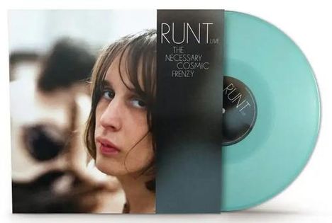 Texte: "RUNT Live", "The Necessary Cosmic Frenzy".  
Cover mit Porträt einer Person, hellblaue Vinyl-Schallplatte.
