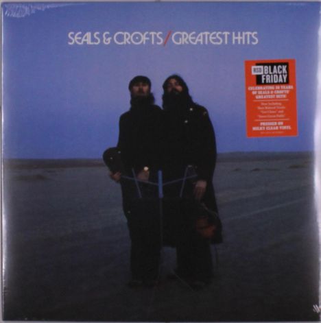 Text: "SEALS & CROFTS / GREATEST HITS." Zwei Personen stehen in einer Wüstenlandschaft bei düsterem Himmel.