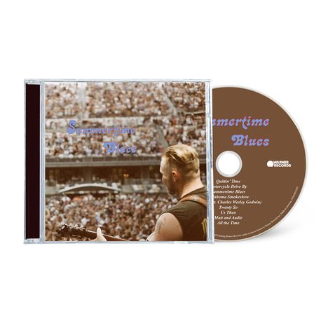 CD mit Text: „Summertime Blues“. Cover zeigt einen Musiker vor einem großen Publikum.