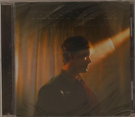 Texte: "Texas Forever", "New Light". Profil eines Mannes im Scheinwerferlicht vor einem Vorhang.