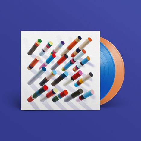 Das Bild zeigt viele bunte, senkrechte Linien auf einer weißen Fläche. Zwei Schallplatten, eine blau, eine orange, sind halb sichtbar.