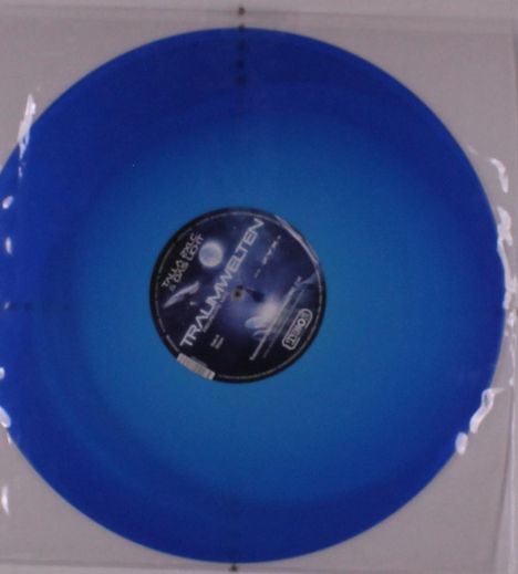 Der Text "TRAUMWELTEN" ist auf einem blauen Vinyl-LP-Label zu sehen.