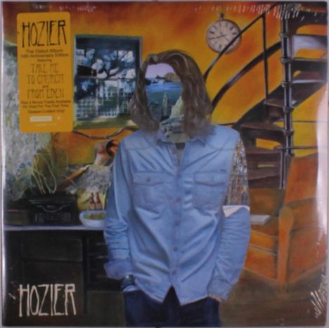 Gelber Text: "HOZIER. The Debut Album 10th Anniversary Edition." Eine Person in einem surrealen Raum mit einer Treppe.