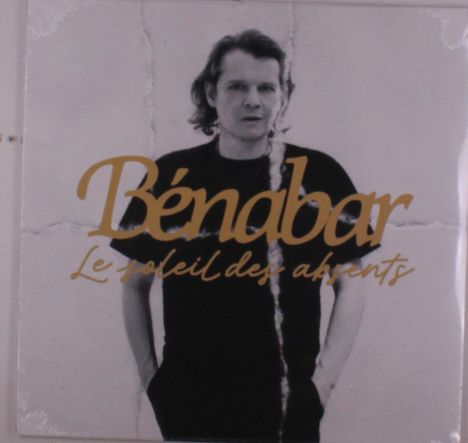 Text: "Bénabar", "Le soleil des absents". Schwarz-weiß Foto einer Person mit lockigen Haaren.