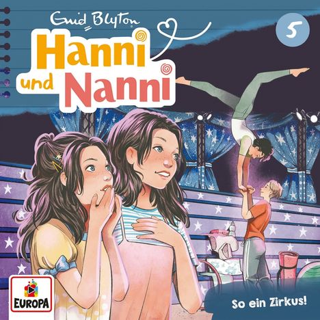 Text: "Hanni und Nanni", "So ein Zirkus!". Zwei Mädchen schauen fasziniert auf eine Zirkusshow mit Akrobaten.