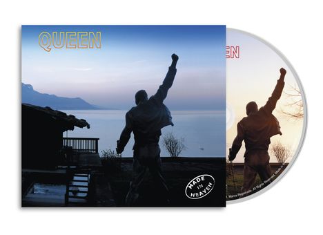 QUEEN oben links, MADE IN HEAVEN unten rechts. Eine Statue vor einem See bei Sonnenuntergang.