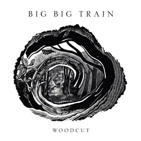 Text: "BIG BIG TRAIN" oben, "WOODCUT" unten. Eine schwarz-weiße Illustration eines Waldes innerhalb einer Spirale.