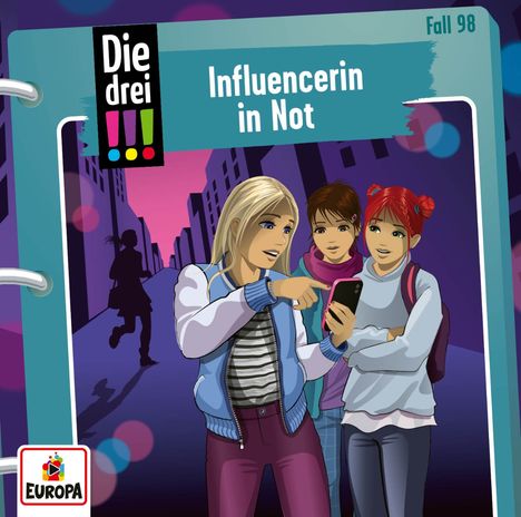 Text: "Die drei !!!", "Influencerin in Not", "Fall 98". Drei Mädchen mit Smartphone in einer Stadt. Logo von Europa in der Ecke.