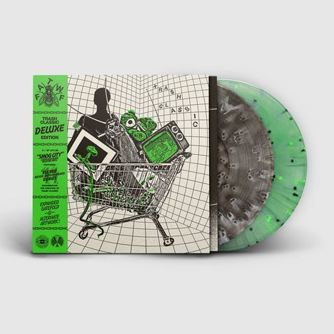 Ein grünes Band links mit Texten wie "TRASH CLASSIC DELUXE EDITION". Zeichnung eines Einkaufswagens mit TV und Figuren.