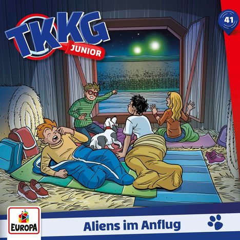 "Aliens im Anflug" steht auf einer Illustration. Vier Kinder und ein Hund beobachten durch ein Fenster zwei Lichter am Himmel.