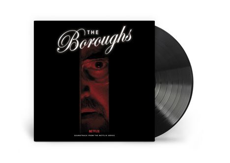 "THE Boroughs", "NETFLIX", "Soundtrack from the Netflix Series". Ein Gesicht, rot beleuchtet, schaut durch einen Spalt.