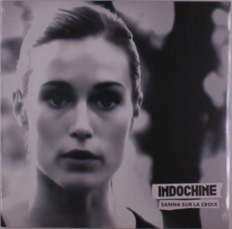 Text: "INDOCHINE SANNA SUR LA CROIX". Schwarz-weißes Foto einer Person mit ernstem Gesichtsausdruck im Vordergrund.