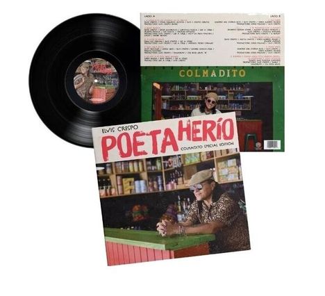 Cover: "Elvis Crespo POETA HERIÓ CULOADITO SPECIAL EDITION". Mann mit Hut lehnt an Verkaufsstand. Vinyl-Platte sichtbar.