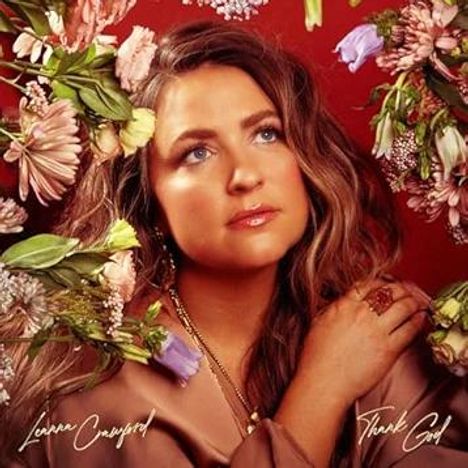 Texte: "Lauren Daigle", "Thank God". Frau mit blonden Haaren, umgeben von bunten Blumen, schaut nachdenklich.