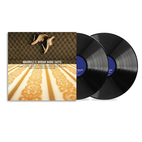 Text: "MAXWELL'S URBAN HANG SUITE". Zwei schwarze Vinyl-Schallplatten und ein Albumcover, darauf hochhackige Schuhe.