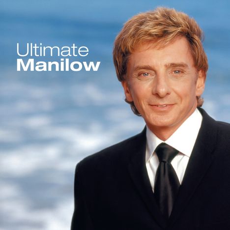 "Ultimate Manilow" erscheint auf einem Albumcover neben zwei Schallplatten. Ein Mann im Anzug lächelt freundlich.