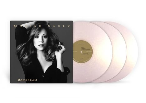 "Mariah Carey Daydream". Schwarz-weißes Cover mit Frau. Drei helle Vinyl-Schallplatten rechts.