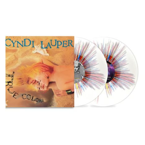 Text: "CYNDI LAUPER TRUE COLORS". Cover zeigt Person mit buntem Haar auf Sand. Zwei Schallplatten mit buntem Muster.