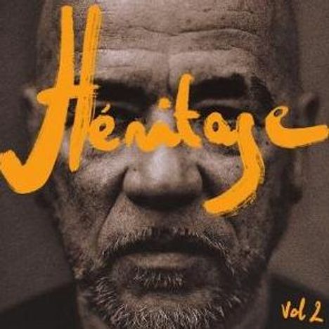 "Héritage vol 2" ist in gelber Schrift geschrieben. Das Bild zeigt das Gesicht eines ernst blickenden Mannes frontal.