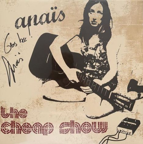 Oben steht "anaïs", unten "the cheap show". Eine Frau mit Gitarre sitzt auf dem Boden. Links ist eine handschriftliche Notiz.