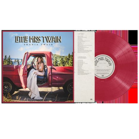 "Little Miss Twain" und "Shania Twain" sind in großer Schrift. Eine Frau sitzt in einem offenen roten Truck. Eine rote Vinylplatte ist zu sehen.