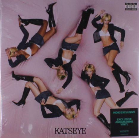 Text: "KATSEYE", "INDIE EXCLUSIVE", "EXCLUSIVE AQUAMARINE VINYL". Fünf Frauen mit blonden Kurzhaarfrisuren in schwarzem Outfit.
