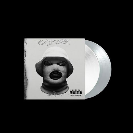„Oxymoron“ steht oben, „Schoolboy Q“ unten. Ein maskiertes Gesicht mit Hut auf grauem Hintergrund, links CD sichtbar.