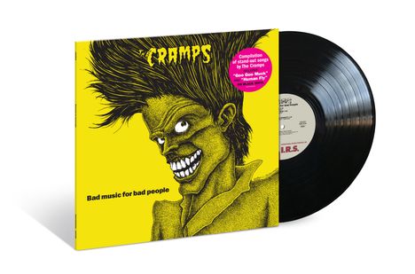 "Compilation of stand-out songs by The Cramps" steht auf einem pinken Kreis. Eine Illustration zeigt ein grinsendes Gesicht.