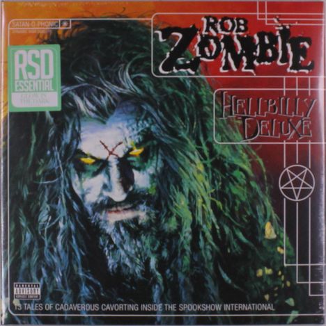 "ROB ZOMBIE HELLBILLY DELUXE" steht in auffälliger Schrift. Darunter ein düsteres, gruseliges Gesicht mit gelben Augen.