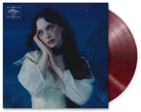 Text oben links: "Hushed..." (nicht vollständig lesbar). Frau in weißem Kleid lehnt den Kopf verträumt auf die Hände, neben ihr rote Schallplatte.