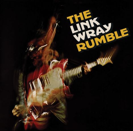 Text: „THE LINK WRAY RUMBLE“. Verschwommene Figur mit E-Gitarre, energetische Bewegungen, dunkler Hintergrund.