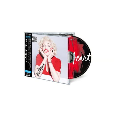 CD-Hülle mit japanischem Text und einem "Rebel Heart" Schriftzug. Frau in rotem Oberteil lächelt, CD mit Kunstmotiv.