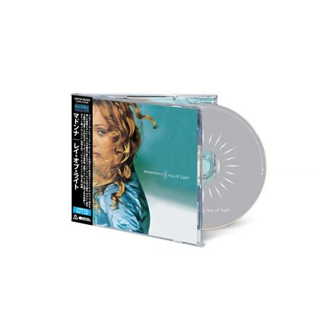 CD-Hülle mit der Aufschrift "MADONNA Ray of Light". Porträt einer Frau mit lockigem Haar und blauem Hintergrund.