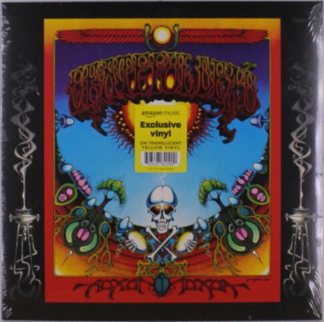 "Exclusive vinyl on translucent yellow vinyl." Illustration mit Totenkopf, Pflanzen und farbenfrohen, psychedelischen Mustern.