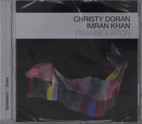 Text: "Christy Doran, Imran Khan, Disambiguation." Buntes, abstraktes Band auf dunklem Hintergrund.