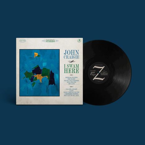 "JOHN CRAIGIE I SWAM HERE" in Blau und Grün auf Albumcover. Abstrakte Malerei in Blau und Grün links. Vinyl rechts daneben.
