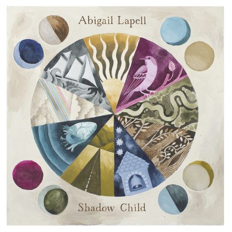 "Abigail Lapell" und "Shadow Child". Eine Illustration mit einem bunten Kreis, der in Segmente mit verschiedenen Motiven unterteilt ist.