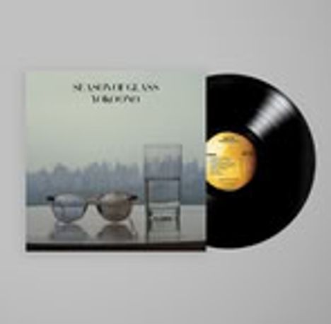 Der Text "SEA WATER GLASS THE RIPPLE" steht auf einem Plattencover. Daneben eine Schallplatte mit gelbem Label.