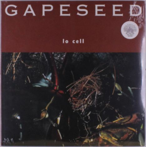 "GAPESEED" oben, "lo cell" darunter. Dunkle, verwobene Natur mit Pflanzen und Ästen.