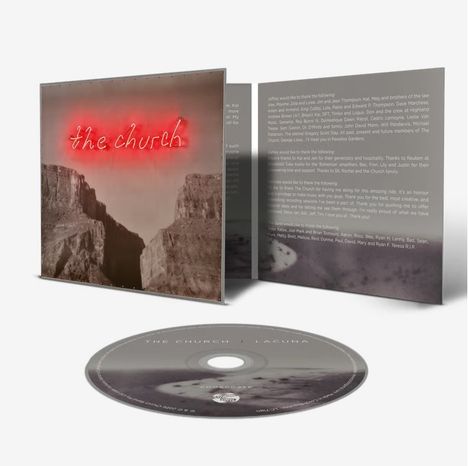 Text vorne: "the church" in leuchtendem Rot.  
Hintergrund: Landschaft mit Schluchten.  
CD-Hülle: Grautöne, Text im Inneren und auf der CD.