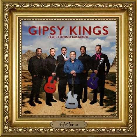Text: "GIPSY KINGS FEAT. TONINO BALIARDO, Historia". 
Sechs Männer mit Gitarren, Landschaft im Hintergrund, goldener Rahmen.
