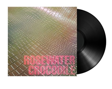 Text: "ROSEWATER CROCODILE". Vinyl-Schallplatte mit einem Cover, das eine krokodilhautähnliche Textur zeigt.