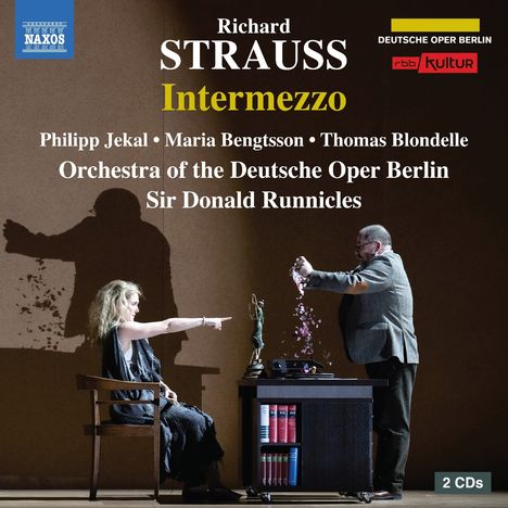 "Richard Strauss Intermezzo" mit Namen von Künstlern und Orchester. Szene mit Frau in Stuhl und Mann an einem Tisch.