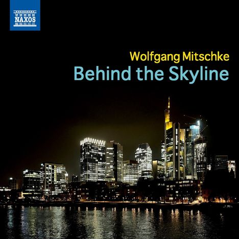 Text: "Wolfgang Mitschke Behind the Skyline." Nachtszene einer beleuchteten modernen Skyline am Wasser. Logo oben links.