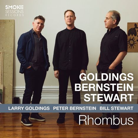 GOLDINGS BERNSTEIN STEWART; LARRY GOLDINGS PETER BERNSTEIN BILL STEWART; Rhombus. Drei Männer vor heller Wand.
