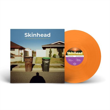 „Skinhead”, „It's a beautiful day, what a beautiful day.” Ein Plattencover mit oranger Vinyl und Hauskulisse.
