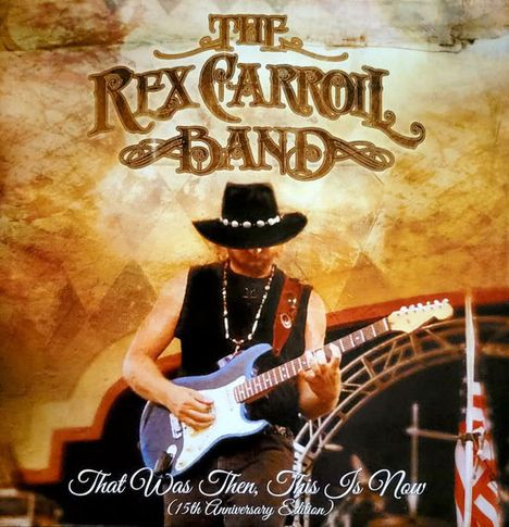 „The Rex Carroll Band“ in stilisierter Schrift oben. Unten: „That Was Then, This Is Now (15th Anniversary Edition)“. Ein Gitarrist mit Hut spielt auf einer Bühne.